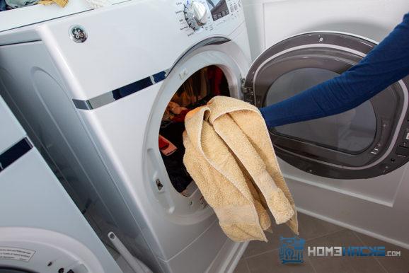 adding a large dry bath towel to shorten drying time
